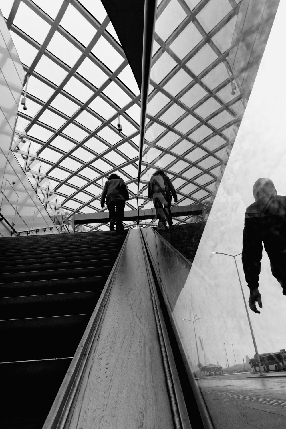 Escalator and ghost figure — Reflections